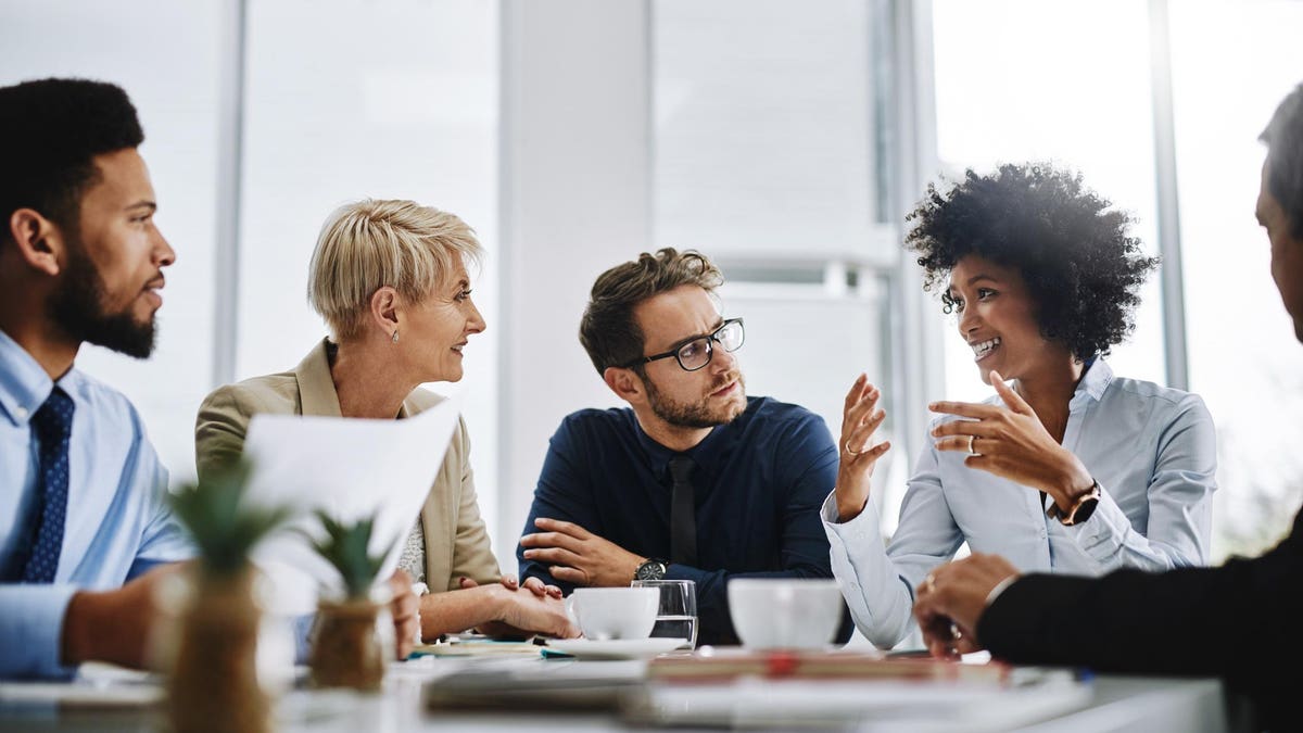 Team in discussion around a meeting table
